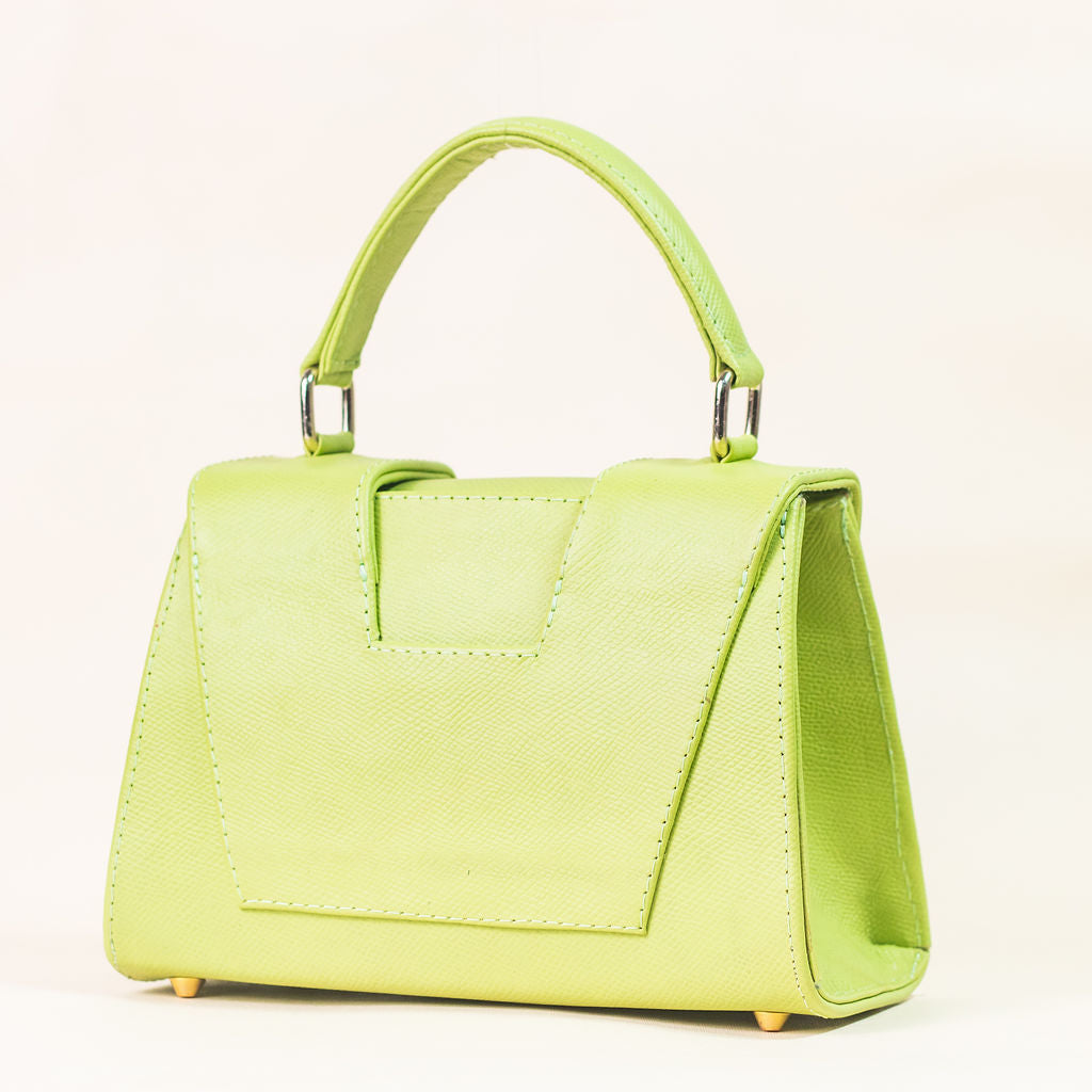 Discover the allure of this women's leather handbag in refreshing lemon hue. Featuring a structured cut, brand signature flap, brass accessories, and an adjustable strap, this handbag is the epitome of everyday elegance and style. Elevate your fashion with this chic accessory designed for the modern woman.