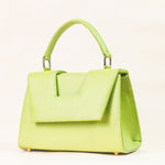 Discover the allure of this women's leather handbag in refreshing lemon hue. Featuring a structured cut, brand signature flap, brass accessories, and an adjustable strap, this handbag is the epitome of everyday elegance and style. Elevate your fashion with this chic accessory designed for the modern woman.