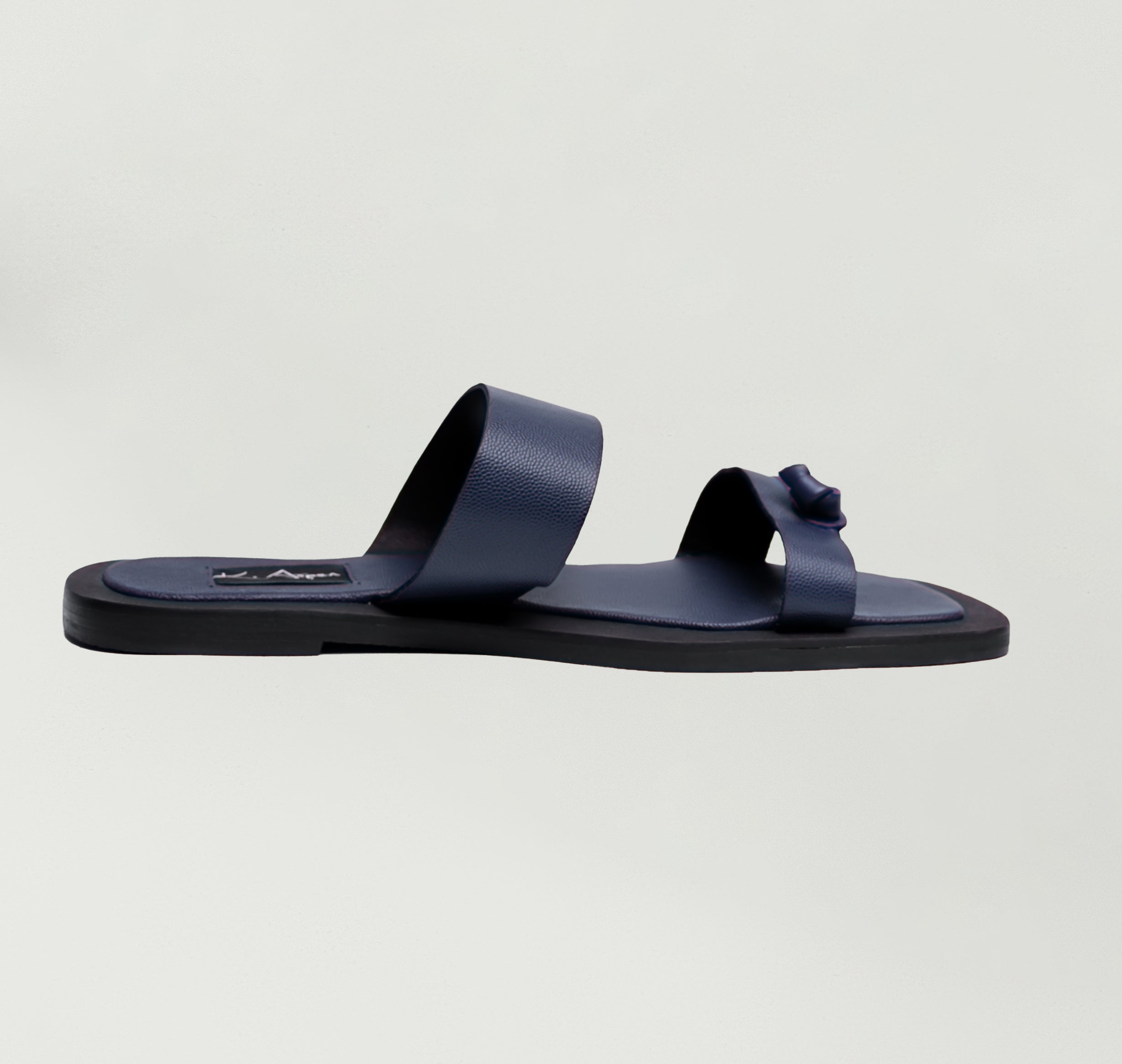 K.Aspen Bantu X Men's Leather Slippers - Premium Leather Finish, Ethically Crafted in Lagos, Nigeria. Hand-stitched with Soft Calf Textured Leather, Featuring a Traditionally Tied Knot. Contemporary Comfort and Style at its Best